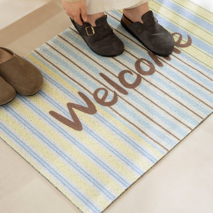 Durable entrance doormat with striped texture and "Welcome" lettering Kalsten