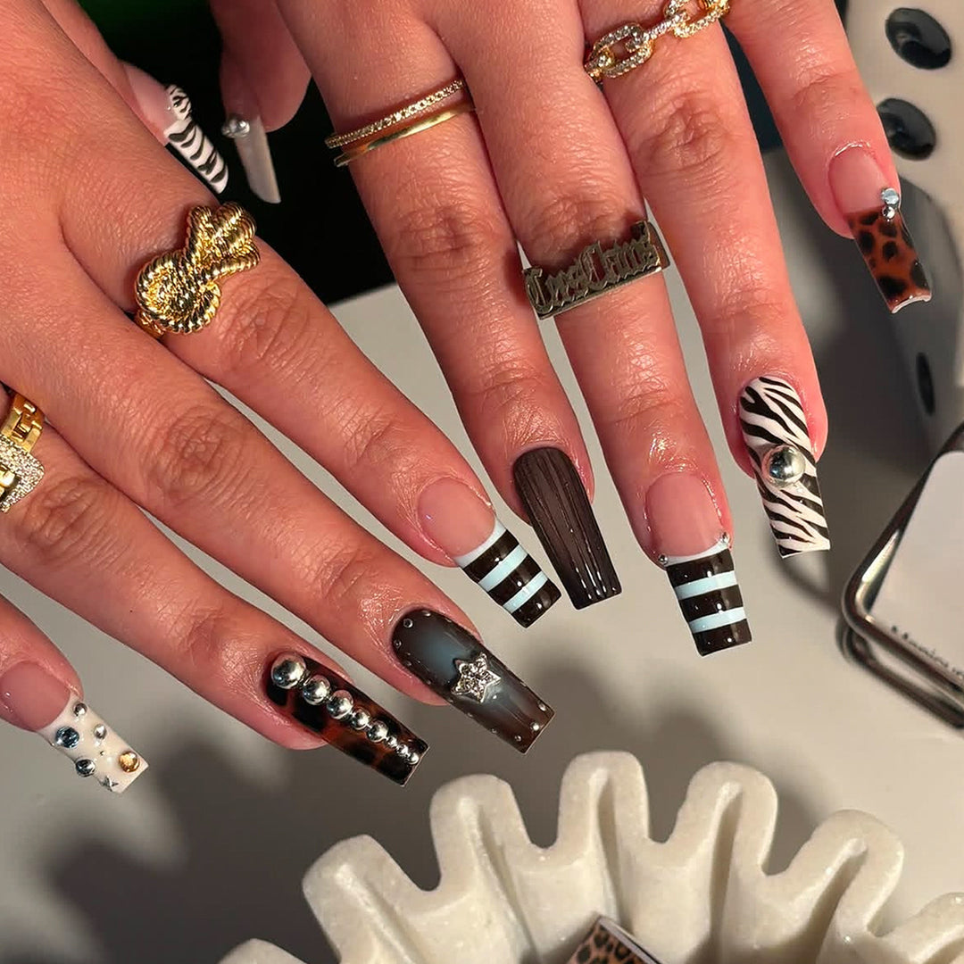 Artificial nails in modern striped design with 3D decoration Kalsten