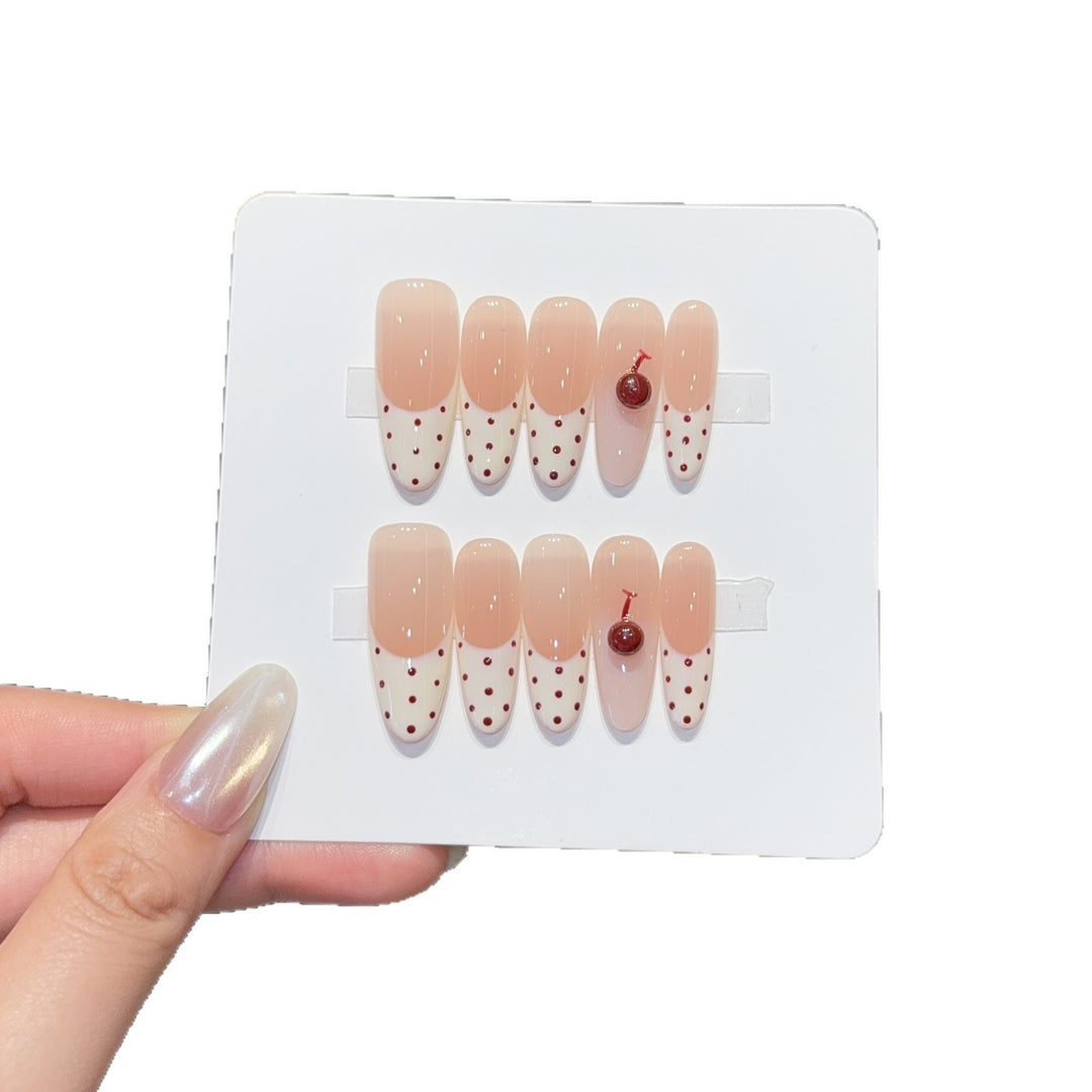 Artificial nails with playful design and cherry accents Kalsten