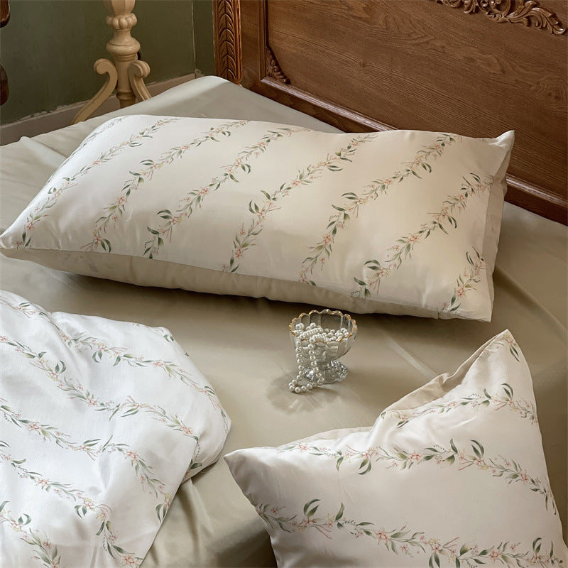 Satin bedding set with floral print and ruffle