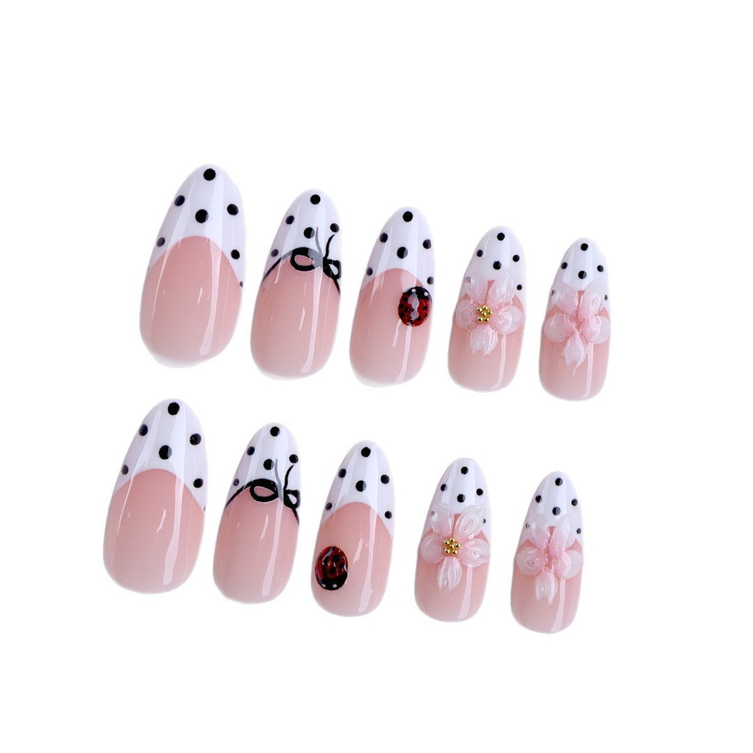 Artificial nail art with floral and playful accents Kalsten