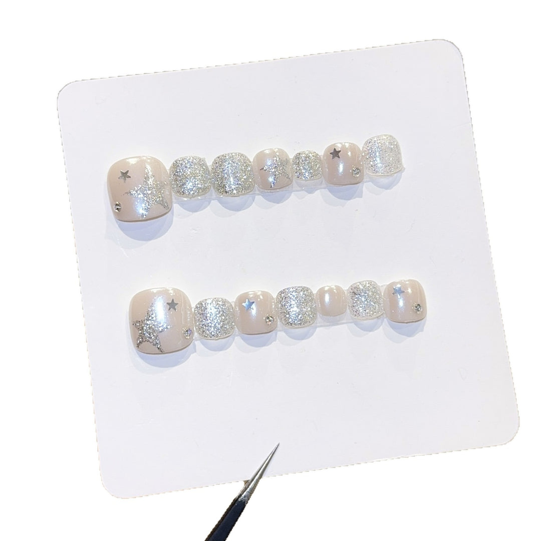 Glamorous artificial nails with sparkling stars and glitter accents Kalsten