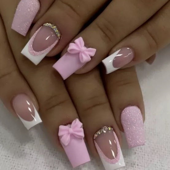 Artificial nail set with playful bows and glitter accents Kalsten