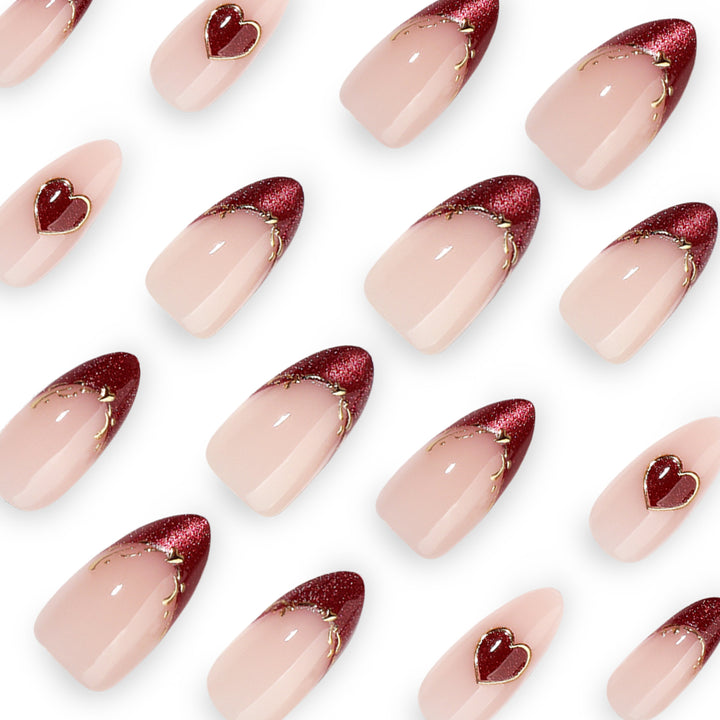 Artful stiletto nails with heart designs and glitter embellishment Kalsten