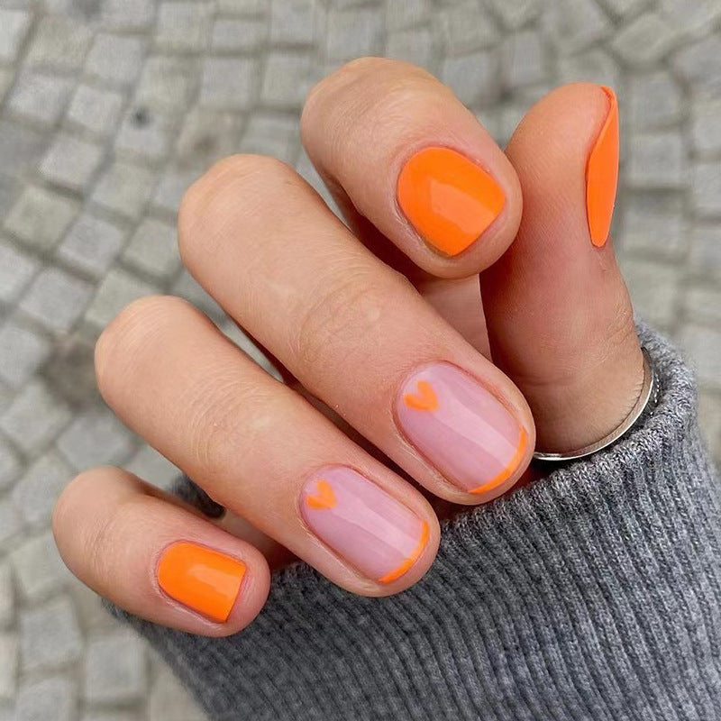 Creative Nail Art with Heart Designs and Neon Accents Kalsten