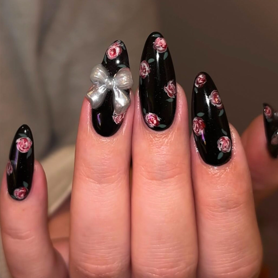 Artificial nails with floral decorations and glamorous bow detail Kalsten