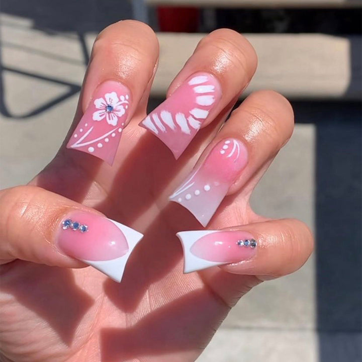 Acrylic nail set with elegant floral designs and glitter accents Kalsten