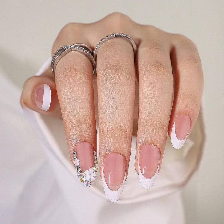 Artificial nails with elegant French tips and rhinestone details Kalsten