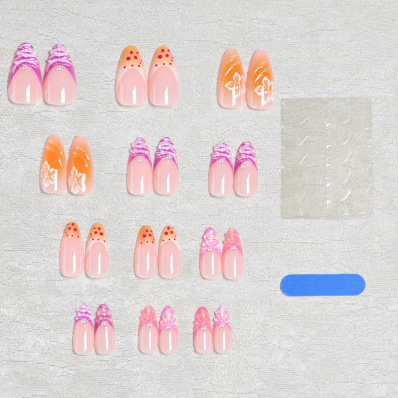 Acrylic nail set with exotic flower patterns and glitter accents Kalsten