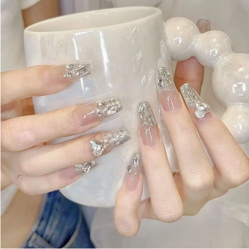Artistic Nail Art with Glitter and Flower Applications Kalsten