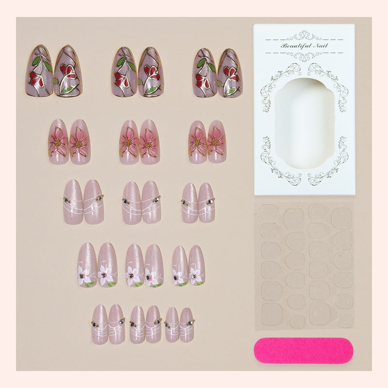 Nail art set with filigree floral decorations and shiny details Kalsten