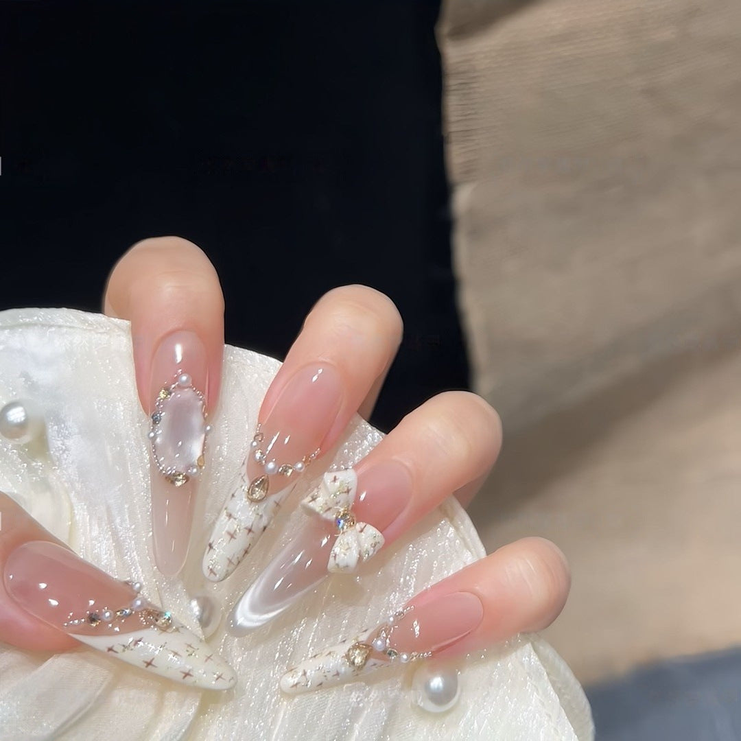 Artificial nails with elegant accents and rhinestone embellishments Kalsten