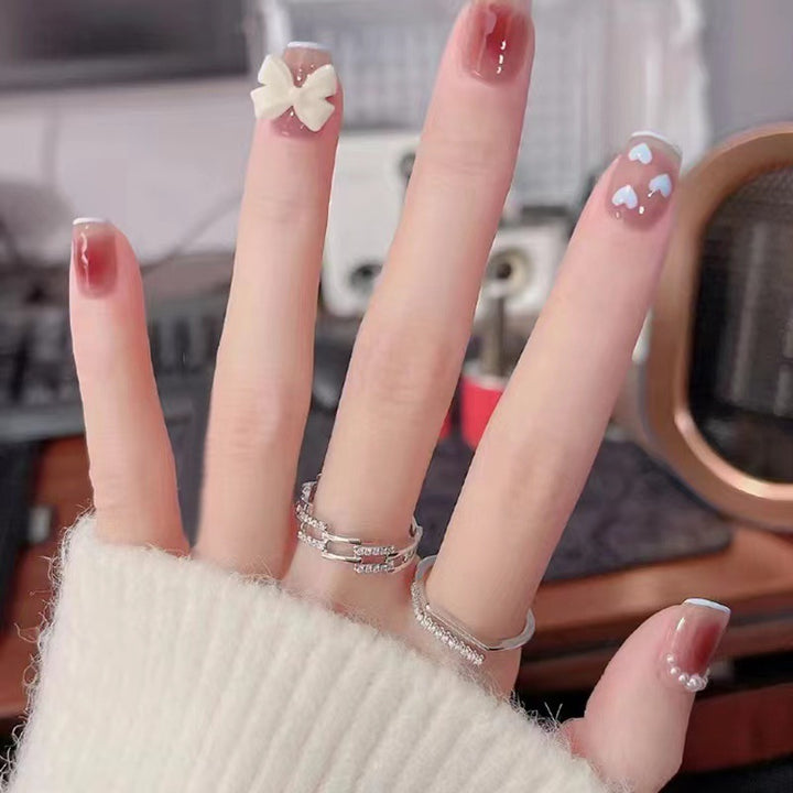 Artistic and elegant nail art with bow accents Kalsten