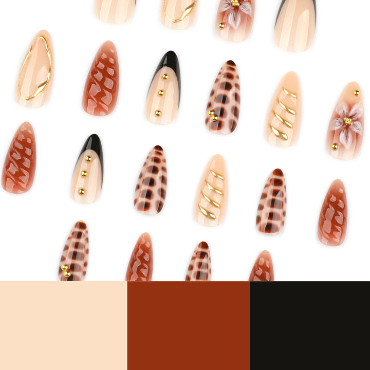 Artificial nails in modern stiletto design with golden accents Kalsten