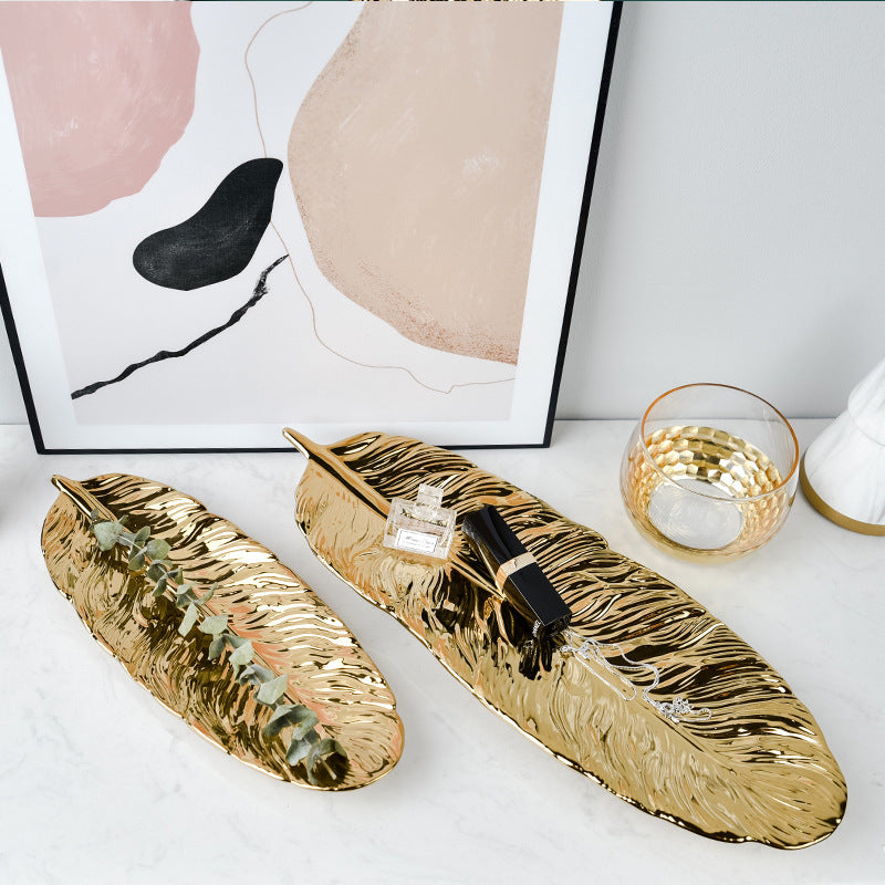 Leaf-shaped decorative tray made of metal with a textured surface