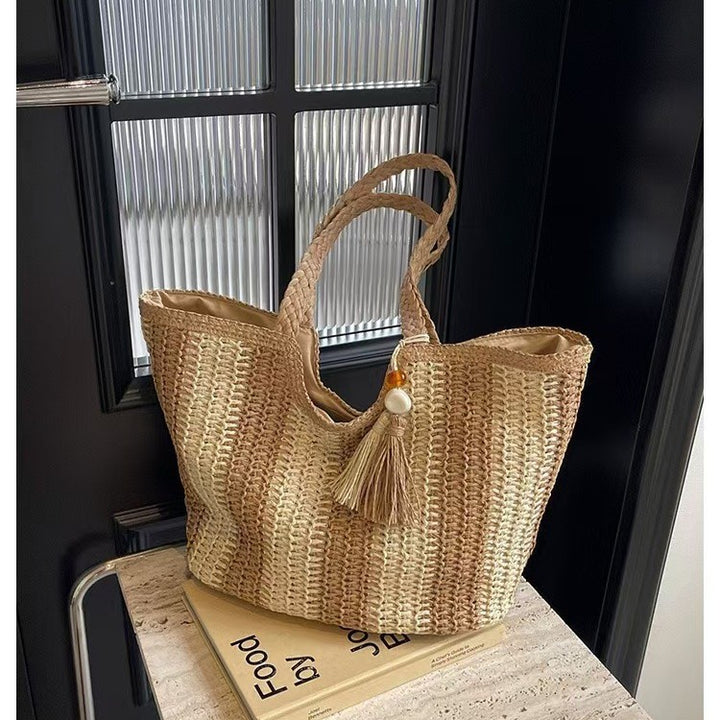 Braided beach bag with decorative tassel pendant Kalsten
