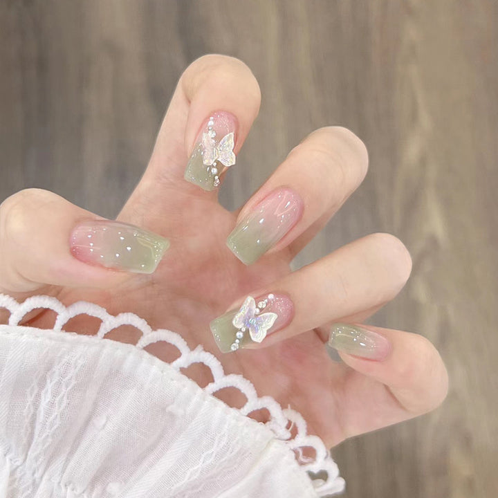 Glamorous artificial nails with delicate flower and glitter effects Kalsten