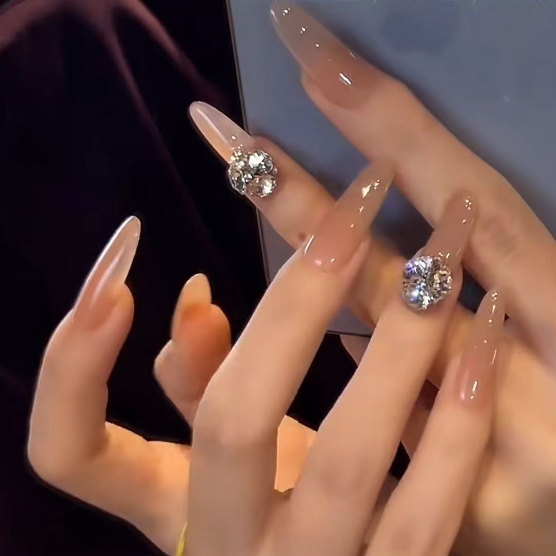 Acrylic nails with glamorous stone accents Kalsten