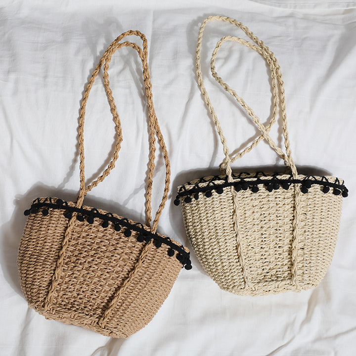 Delicate beach bag with pompons Kalsten