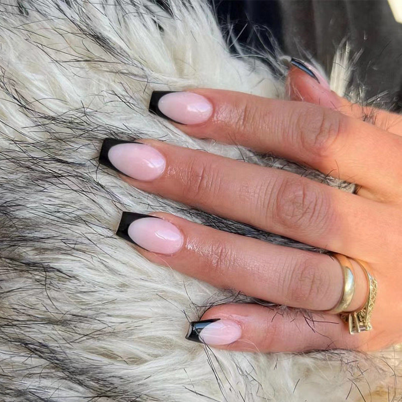 Elegant stiletto nails with contrasting French tip Kalsten