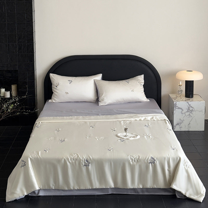 Satin bedding set with playful whale print and silky shiny surface