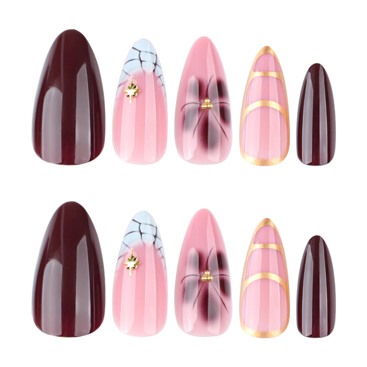 Artful Stiletto nails with gold accents and decorative floral designs Kalsten