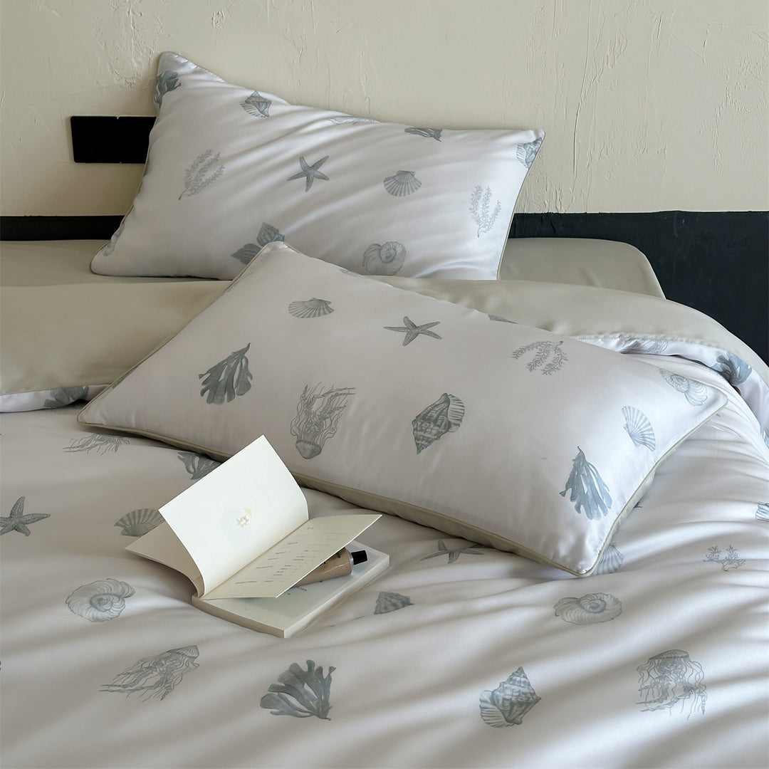 Luxurious satin bedding set with floral watercolor print, ruffled edges and reversible function