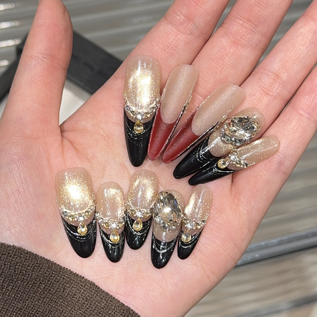 Glamorous artificial nails with extravagant rhinestone and glitter insets Kalsten
