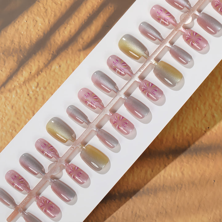 Artificial nails in modern ombre design with floral accents Kalsten