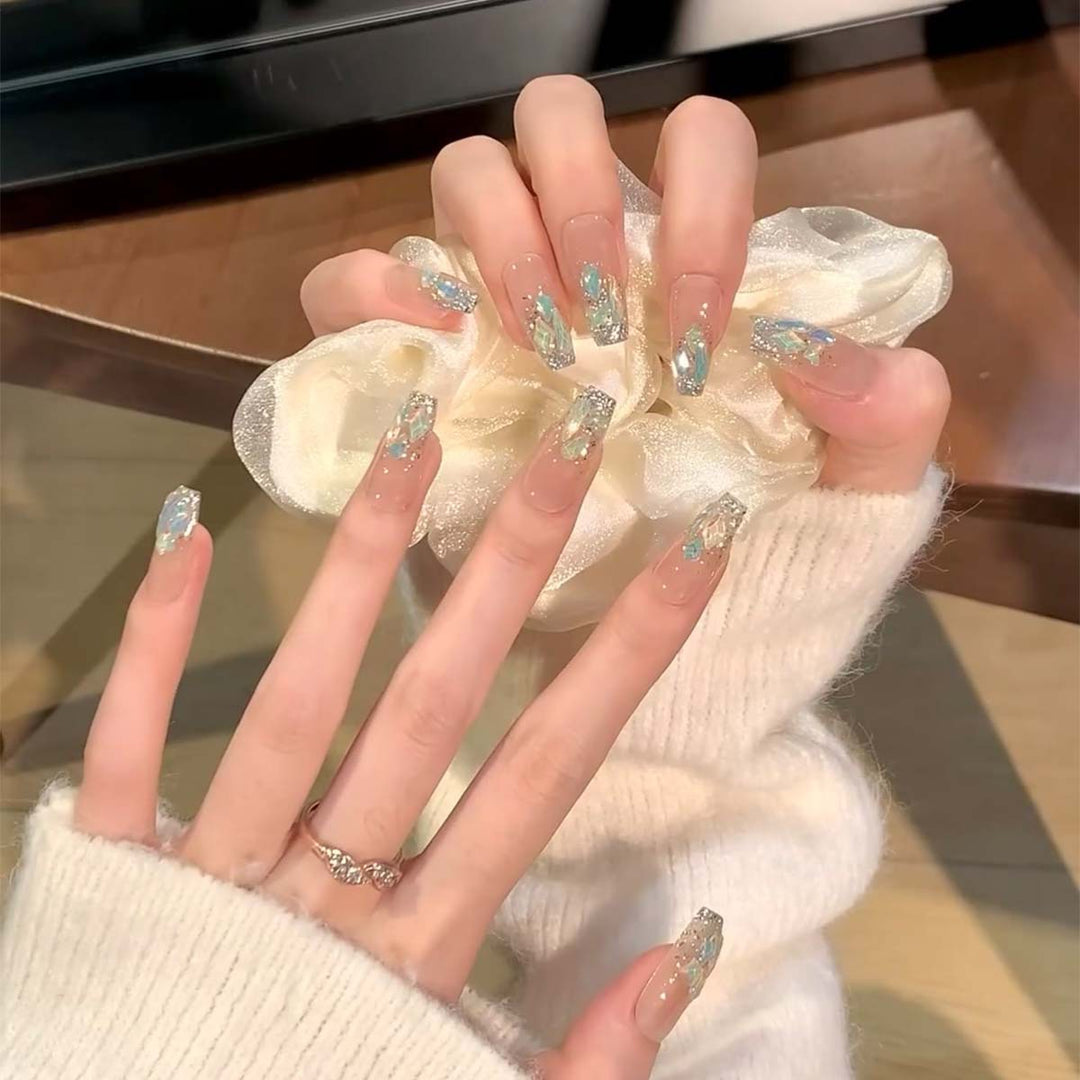 Glamorous nail tips with glitter accents Kalsten