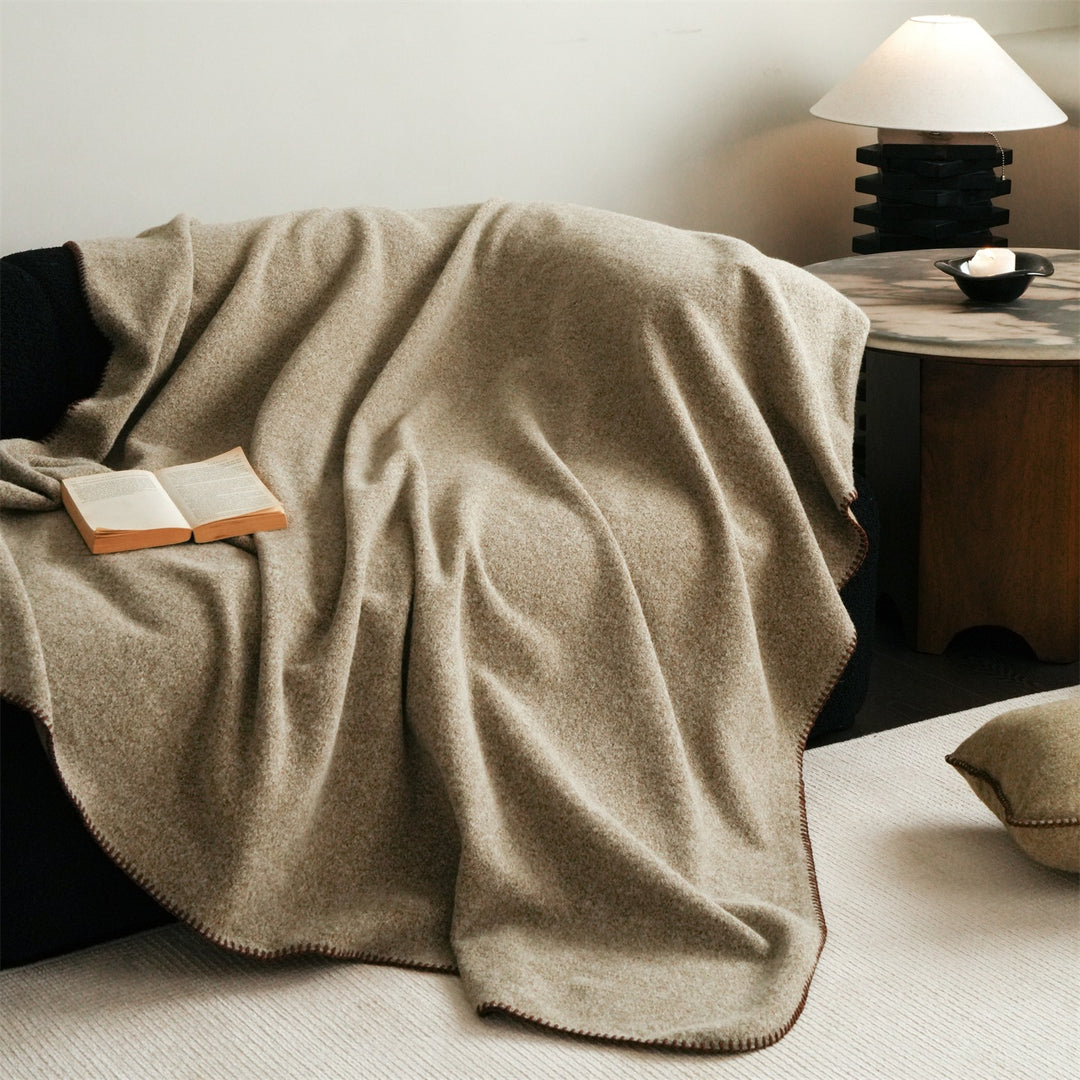 Premium wool blanket with fine hand-stitched edge and particularly soft drape
