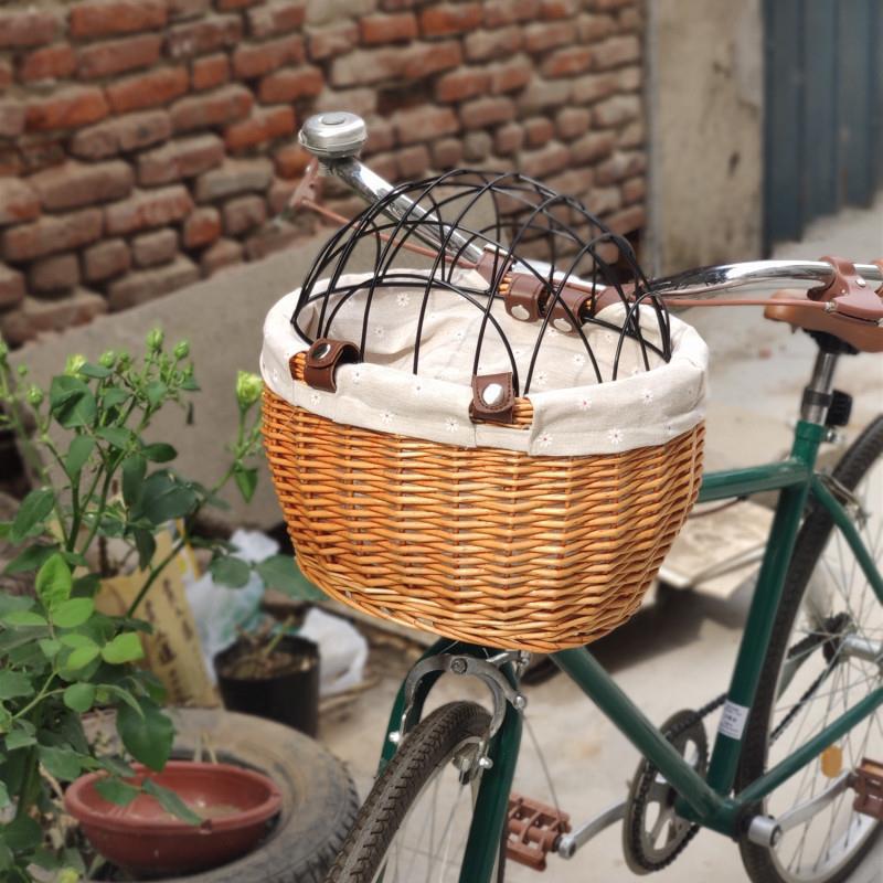 woven rattan pet carrier basket with detachable linen liner and foldable metal safety dome Kalsten