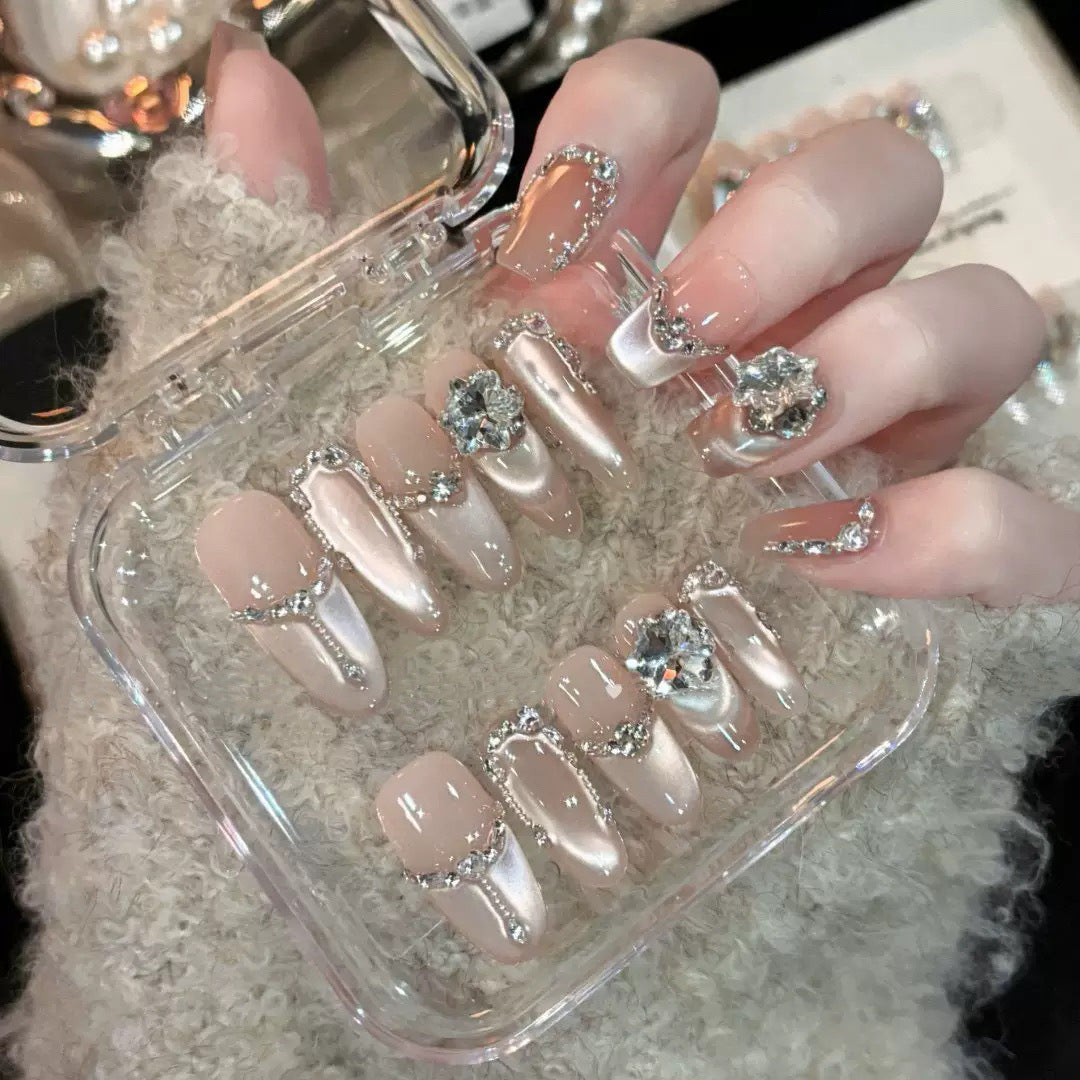 Glamorous nail tips with rhinestone and glitter effects Kalsten