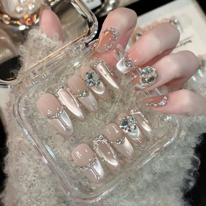Glamorous nail tips with rhinestone and glitter effects Kalsten