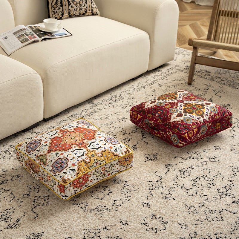Square decorative cushion with oriental medallion print, piping and carrying handle