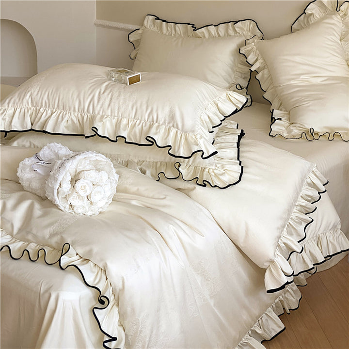 Noble cotton satin bedding set with flounce ruffles, jacquard floral border and contrasting piping.
