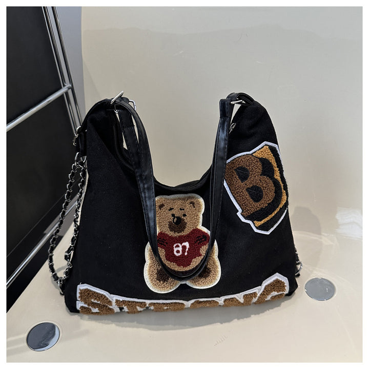 Shoulder bag in playful bear pattern Kalsten
