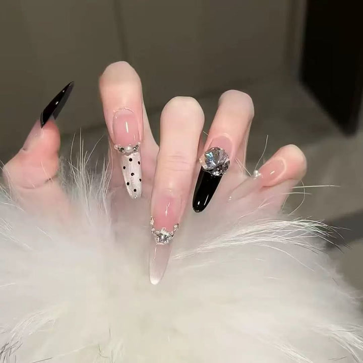 Acrylic nail set with elegant tips and glamorous rhinestone accents Kalsten