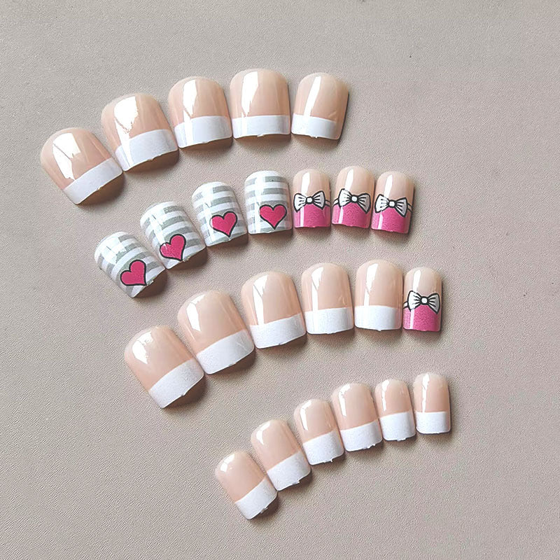 Artificial nails with playful heart and bow pattern Kalsten