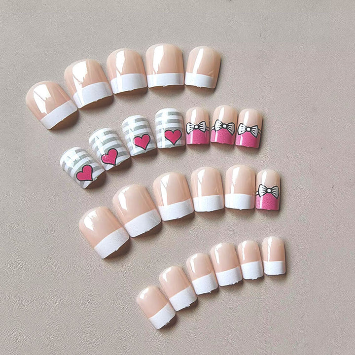 Artificial nails with playful heart and bow pattern Kalsten