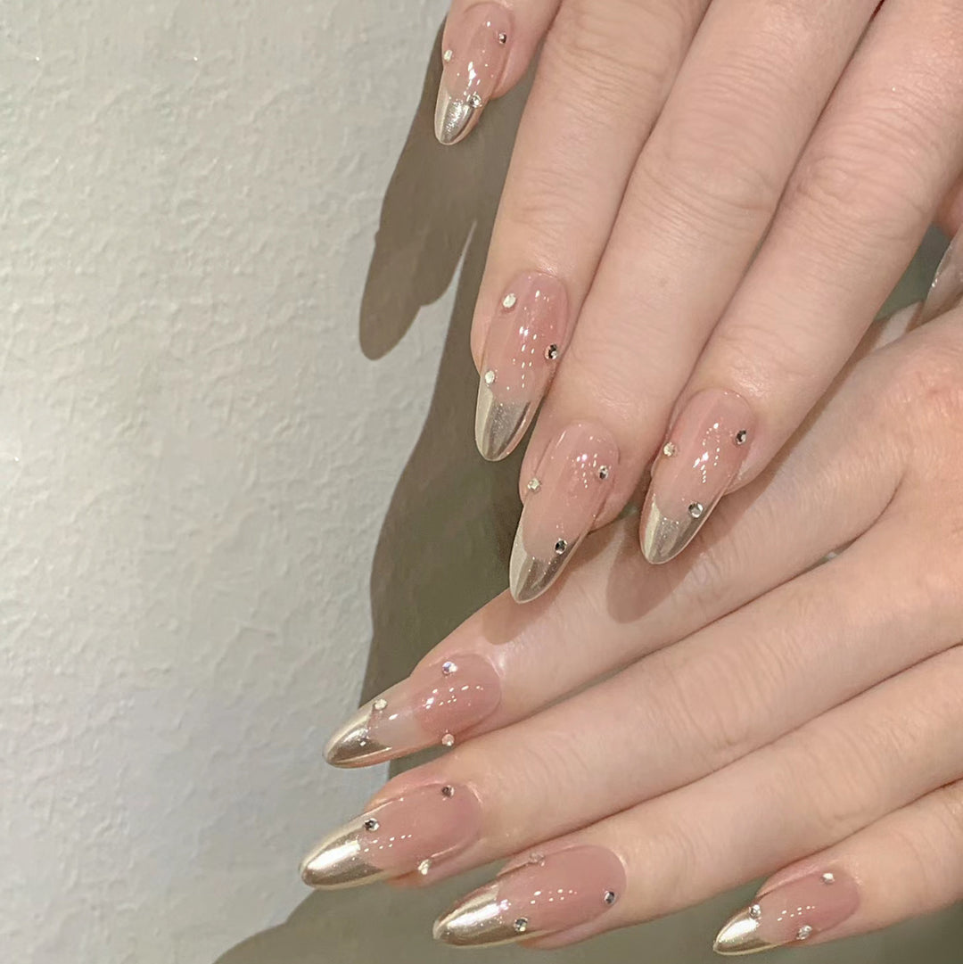 Artificial nail set with elegant metallic shades and rhinestone decorations Kalsten