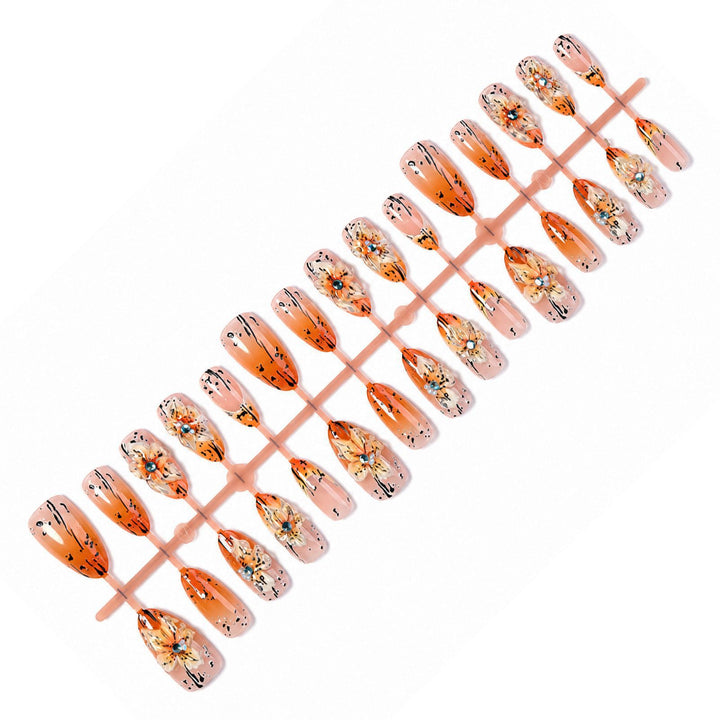 Artificial nail set with elegant floral design and sophisticated glitter elements Kalsten