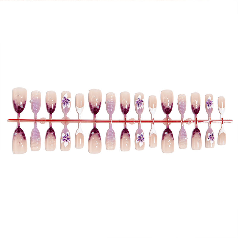Artificial nails with elegant ombre effects and floral accents Kalsten