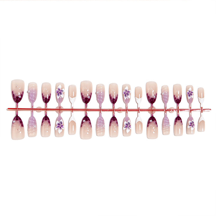 Artificial nails with elegant ombre effects and floral accents Kalsten