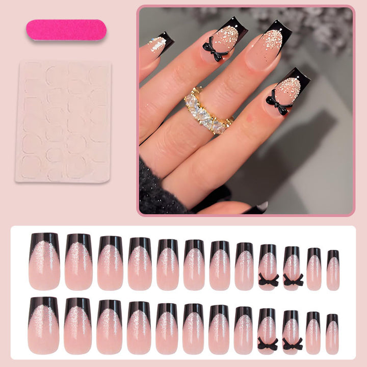 Artificial nail set with elegant glitter accents and bow details Kalsten