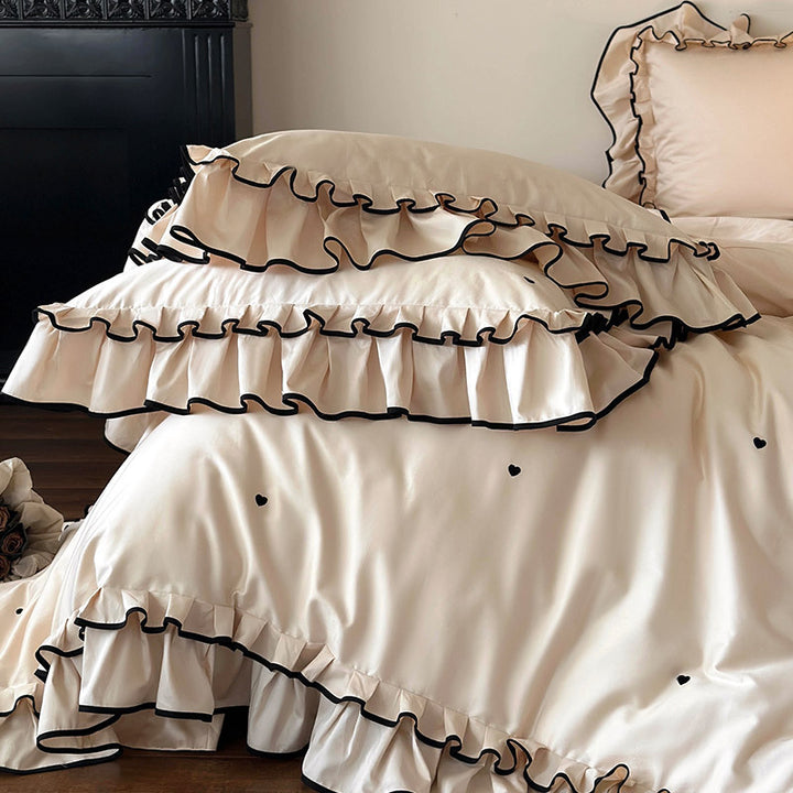Cotton satin bed set with double-layer ruffled trim, contrast edge and heart embroidery