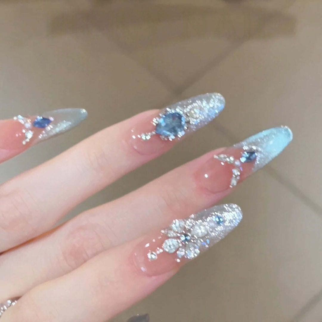 Glamorous artificial nails with sparkling rhinestone accents Kalsten