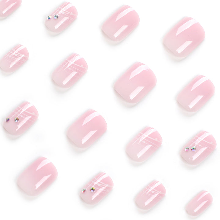 Artful nail extensions with elegant design and rhinestone embellishments Kalsten