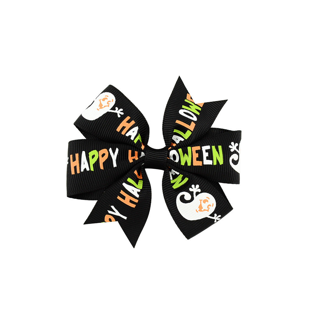 Halloween bow with pumpkin and witch motifs
