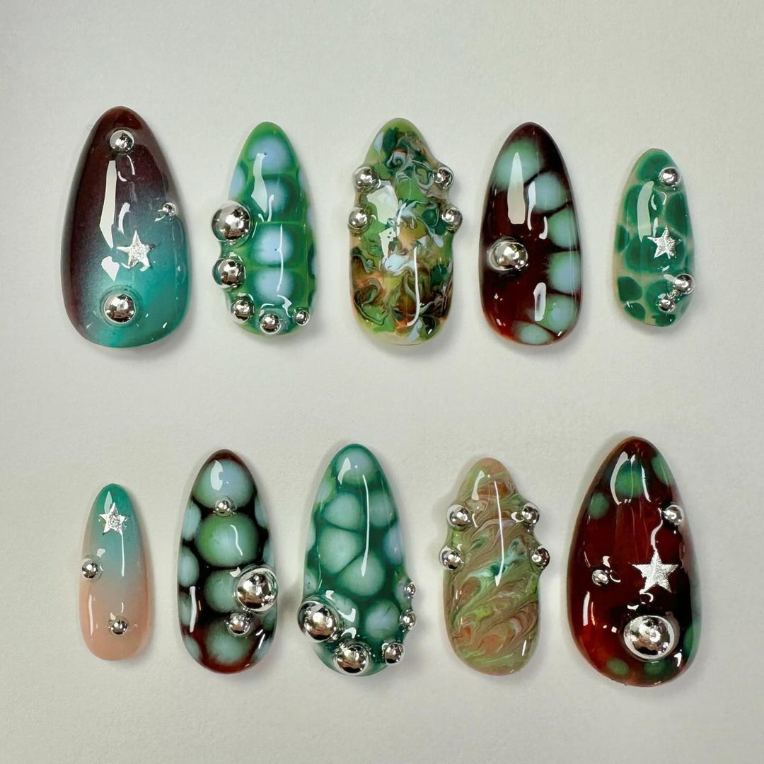 Creative artificial nails with 3D details and unique color accents Kalsten